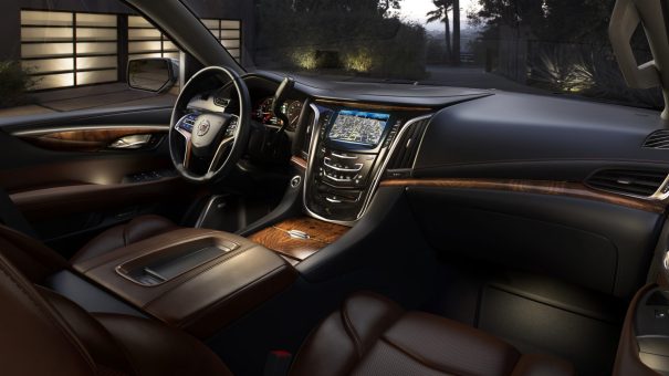 The 2015 Cadillac Escalade's all-new interior combines luxurious handcrafted elements, shown here in Kona/Ebony with elm cluster open-pore wood trim.